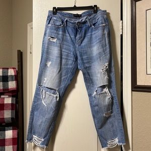 Ripped up- frayed bottom. Comfortable jeans. Relaxed